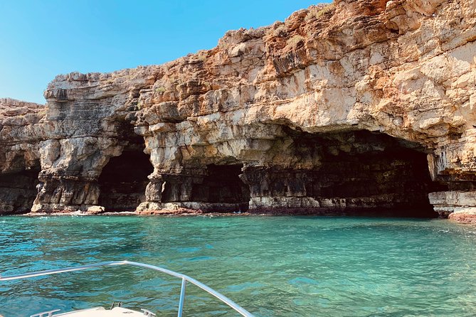 Boat tour of the Polignano a Mare caves with aperitif - Grotta Azzurra beneath Santo Stefano