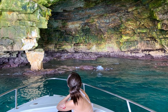 Boat tour of the Polignano a Mare caves with aperitif - Grotta Palazzese and its bathing history