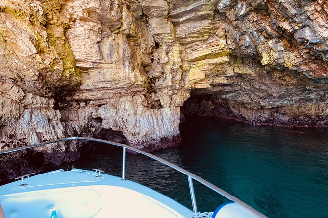 Boat tour of the Polignano a Mare caves with aperitif - Scoglio dell’Eremita and the cross at sea