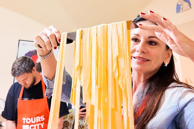 Bologna Local Pasta Cooking Class, Ragu, Spritz, Wine & Gelato - Mixing eggs and flour by hand