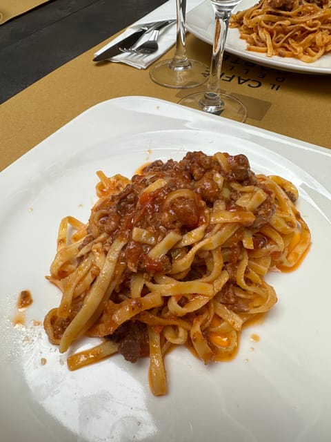 Bologna: Walking Food Tour and Highlights with a Local Guide - Piazza Galvani and the first taste of Bologna