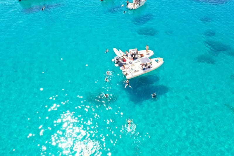 Cagliari: Boat Tour, 4 Stops, Swim, Snorkeling, & 1 Spritz - Port departure and the chance to spot dolphins
