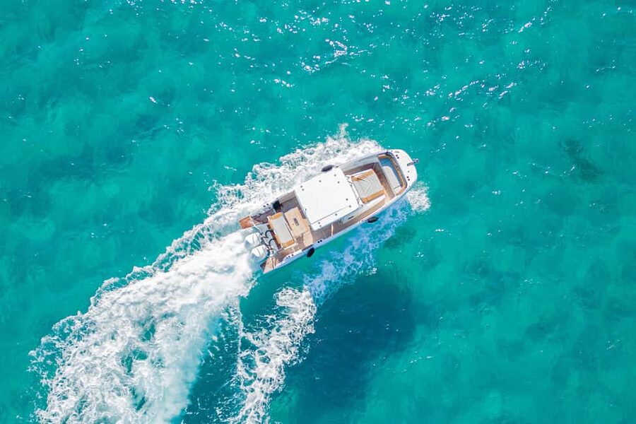 Cagliari: Luxury Motorboat Tour with 3 Swim Stops & Wine - Wine, water, and what is not included