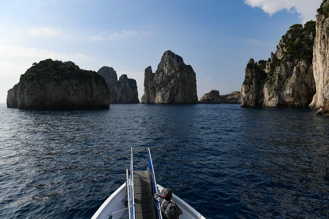 Capri Coast to Coast: Boat Tour with Optional Blue Grotto - The western coast: grottoes and Punta Carena