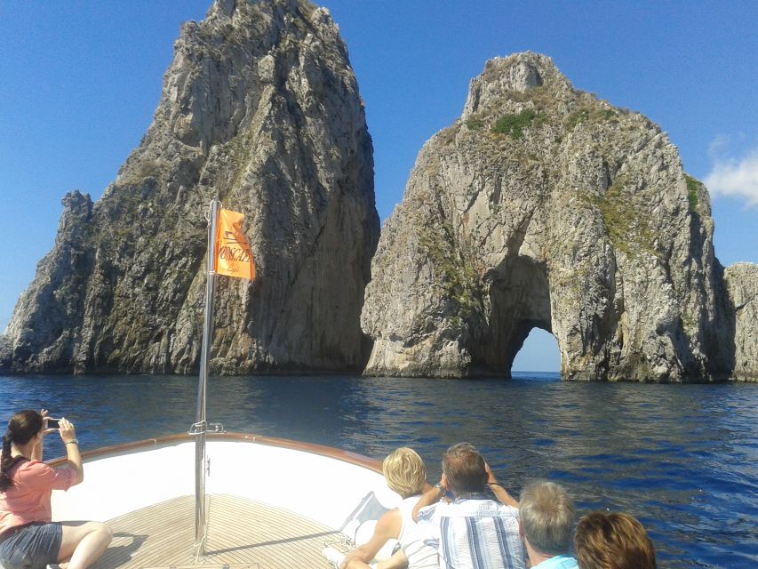 Capri: Island Boat Tour with Blue Grotto Stop - Punta Carena Lighthouse marks the western end
