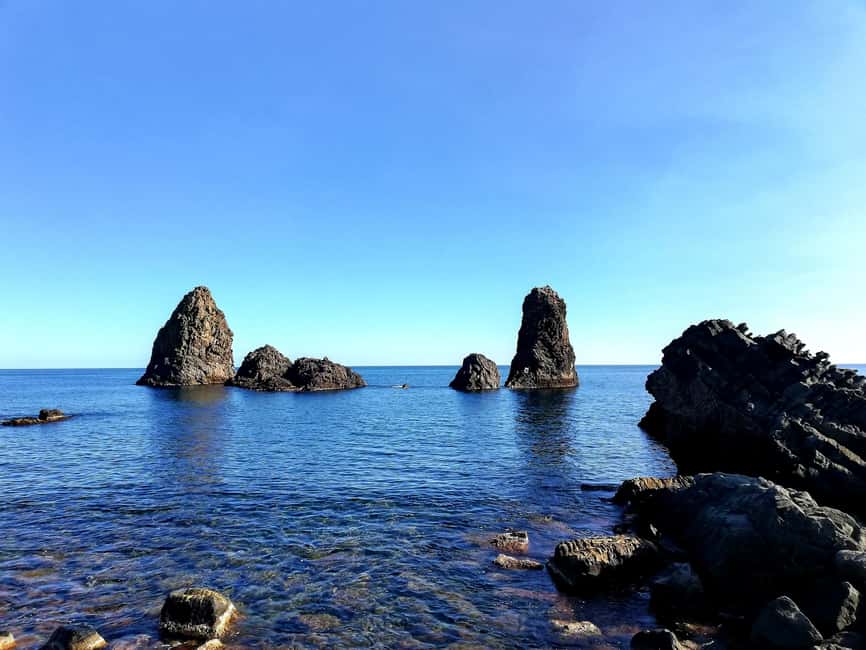 Catania: Cyclops Coast Cruise with Appetizer & Snorkeling - The Cyclopean Isles with Mount Etna behind you