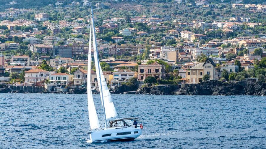 Catania: Sail Tour of Cyclops Coast with Sicilian Aperitif - Small groups, friendly crews, and a relaxed pace