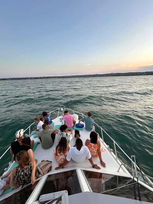 Desenzano del Garda: Sunset Boat Trip at Sunset with Drink - Weather can change the evening