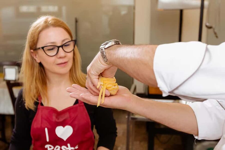 Florence: Pasta Class with Wine, Limoncello and Dessert - Mixing eggs and flour from scratch