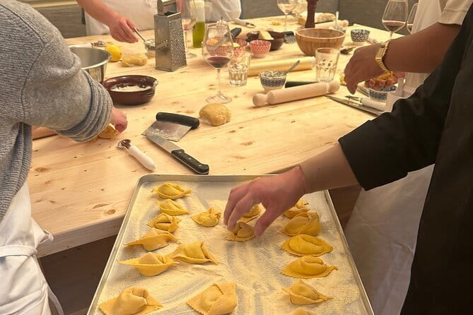Florence: Pasta Cooking Class with Unlimited Wine - Cooking pasta inside a 1200s tower
