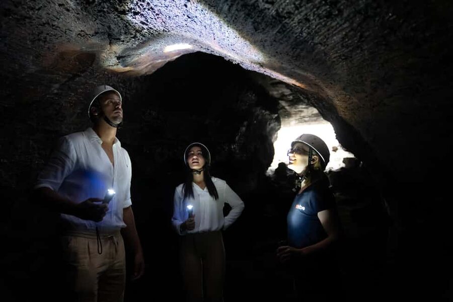 From Catania: Mount Etna Sunset Tour with Tasting and Cave - Entering a lava cave from the 1792 eruption