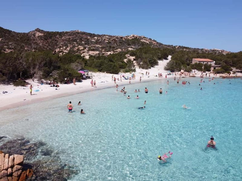 From Palau: 4 stops boat tour to La Maddalena archipelago - Guide, languages, and the onboard atmosphere