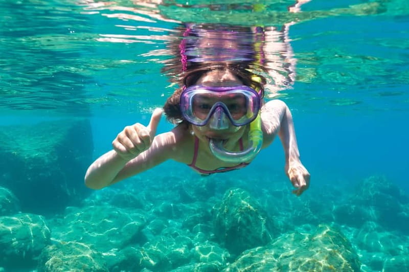 Golfo Aranci: Tavolara and Molara Snorkeling Dinghy Tour - Cruising Beneath Tavolara’s Sheer Cliffs