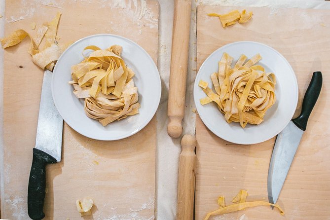 Learn to Make Pasta & Tiramisu with Wine and Limoncello Included - Sitting down to eat after the lesson
