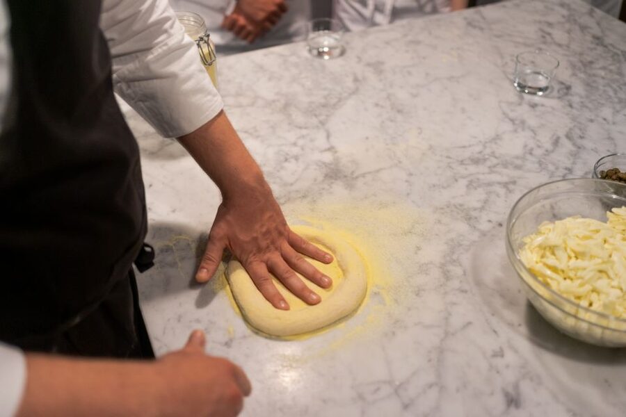 Milan: Pizza or Pasta and Gelato-Making Class with Wine - Rolling dough with a professional pizzaiolo