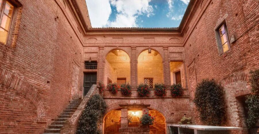 Montalcino: Brunello Wine Tasting & Lunch in a Tuscan Castle - Walking through the vineyard with a sommelier
