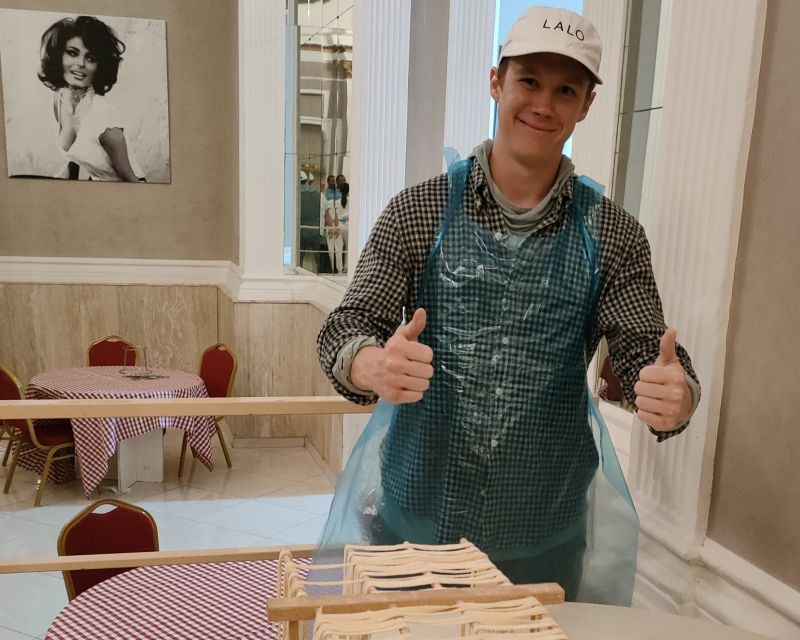 Naples: Pasta Making Class with Starter and Drink - Cutting fettuccine and preparing the sauces