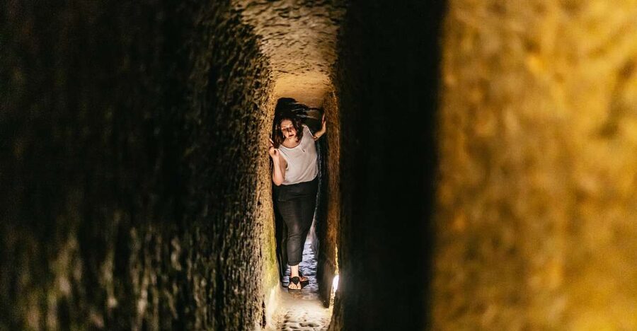 Naples: Spanish Quarters Underground Guided Tour - The Neapolitan Aqueduct and old wall writing