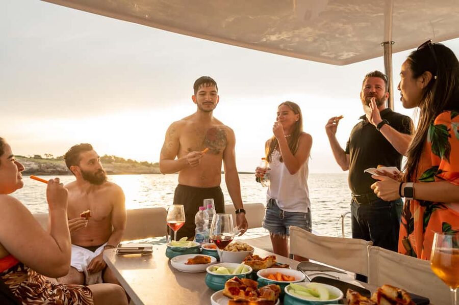 Polignano a Mare: Catamaran Tour with Aperitif & Local Food - Grotta Palazzese from offshore