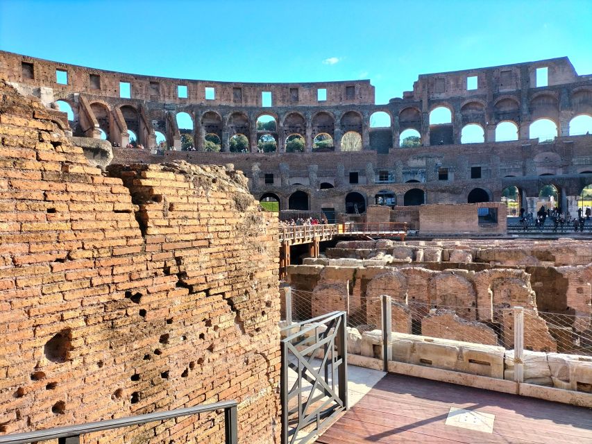 Rome: Colosseum and Ancient Rome Guided Walking Tour - Walking through the Roman Forum
