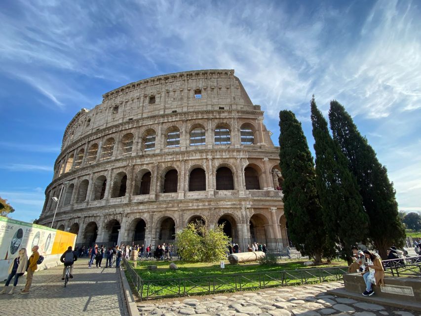 Rome: Colosseum, Roman Forum, and Palatine Hill Ancient Tour - Entering the Colosseum through the first and second levels
