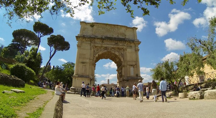Rome: Colosseum, Roman Forum, and Palatine Hill Tour - Walking through the Roman Forum