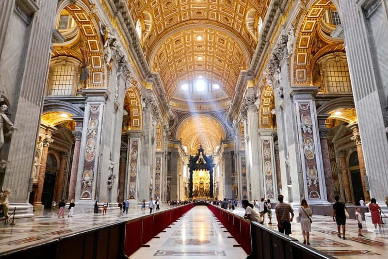 Rome: Guided Tour of St. Peter's Basilica, Grottoes & Square - Inside the Basilica: marble, mosaics, and scale