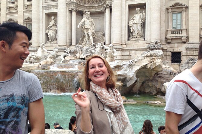 Rome in a Day Group Tour with Vatican Museums and Colosseum - Walking through the Roman Forum