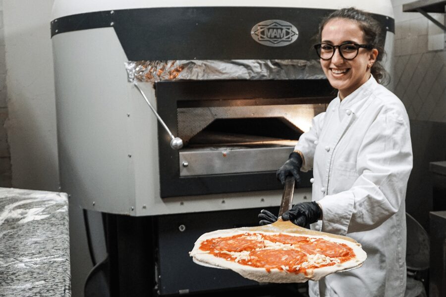 Rome: Traditional Pizza Cooking Class near Piazza Navona - Stretching the dough and choosing toppings