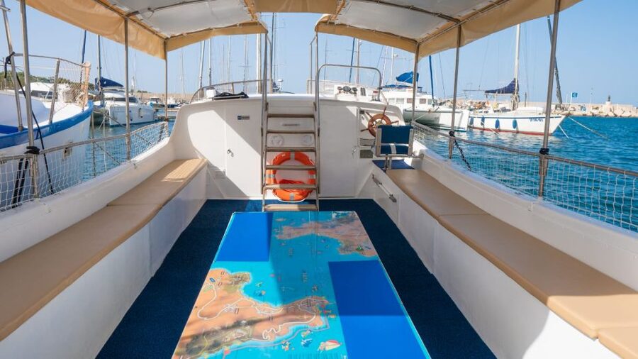 San Vito Lo Capo: Boat Trip with 3 Swimming Stops and Snacks - A small boat, shade, and a relaxed pace