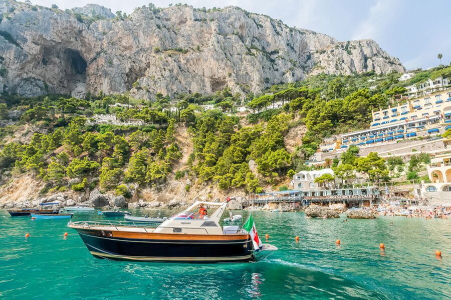 Sorrento: Exclusive Capri Boat Tour and Optional Blue Grotto - Setting out from Sorrento on a 12-person boat