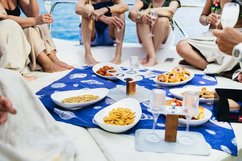 Taormina: Sunset Boat Tour with Dolphin Watching & Aperitif - Swimming and snorkeling near Isola Bella